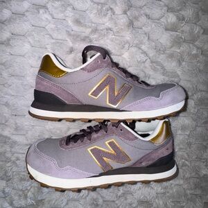 Women’s New Balance 515 sneakers in a grey/purple and gold colorway